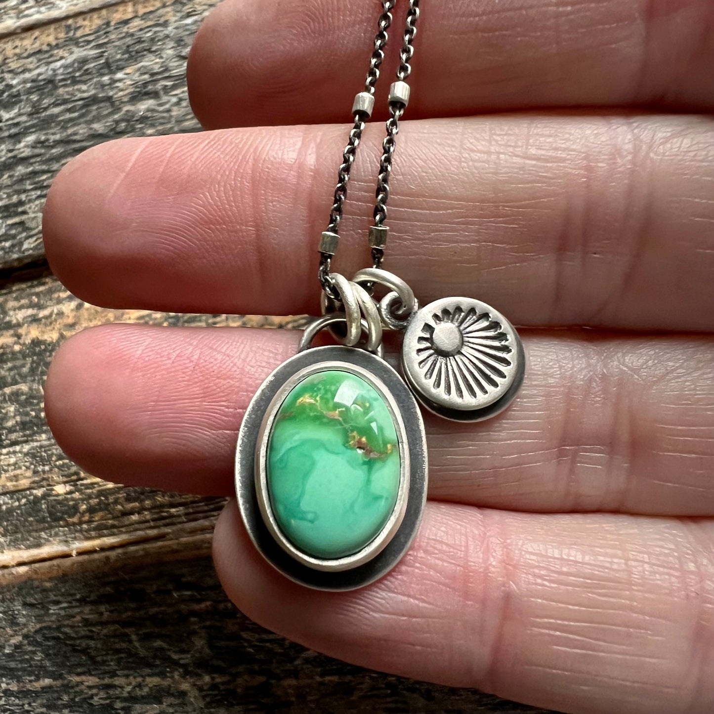 Emerald Valley turquoise and hand stamped sunburst charm necklace